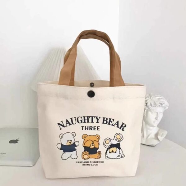 Canvas Tote Bag “Naughty Bear Three” — Cartoon Print, Snap Closure, Brown Handles — 27 × 22 × 8 cm